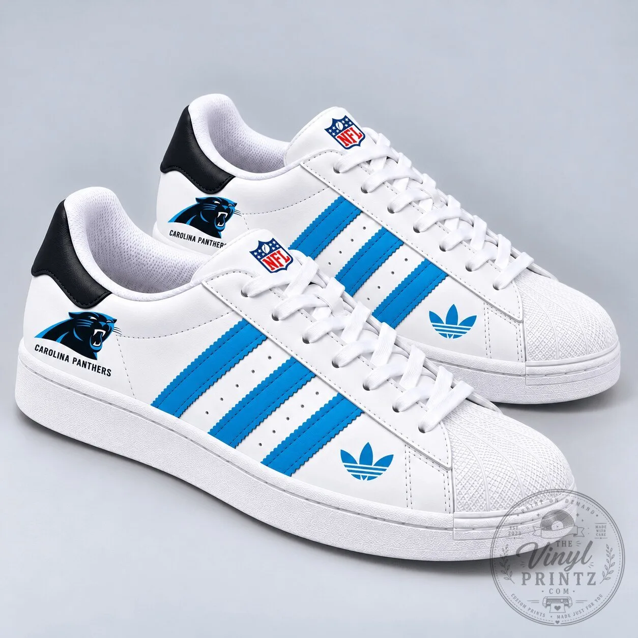 White and Blue Shoes Featuring Carolina Panthers NFL Team Logo
